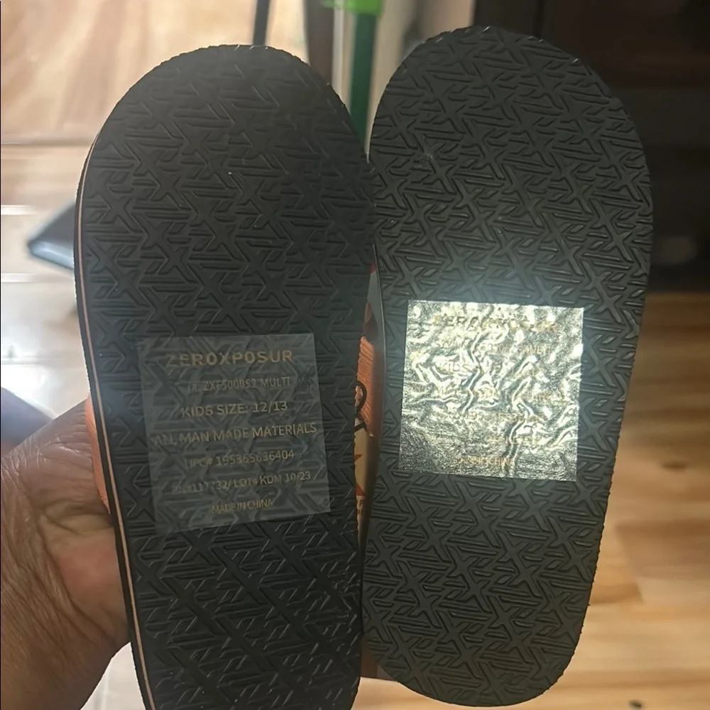 ZeroXposur Orange and Black Flip Flops Vibrant Style